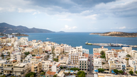 AGIOS NIKOLAOS, GREECE - JULY 24, 2018: Aerial view to Agios Nikolaos, town on Crete island in...