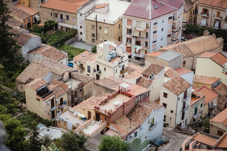 Panorama view on cityscape of Cefalu from drone. Roofs of houses with terraces close-up. Sicily, Italyの写真素材