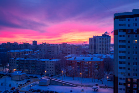 The sunset scarlet clouds. City buildingの写真素材