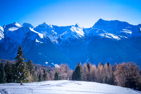 Sunny winter landscape at Ski Area in Dolomites, Italy - Alpe Lusia. Ski resort in val di Fassa near Moenaの写真素材