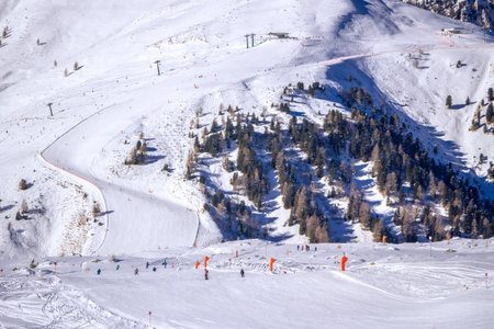 Sunny winter landscape at Ski Area in Dolomites, Italy - Alpe Lusia. Ski resort in val di Fassa near Moenaの写真素材