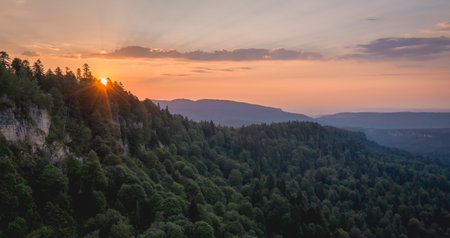 Sunset over the coniferous forest. Lagonaki plateau, Caucasus, Russiaの写真素材