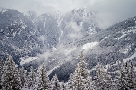 Famous Austria's resort town of Bad Gastein in Alps mountains. Frosty winter day with snowfallの写真素材