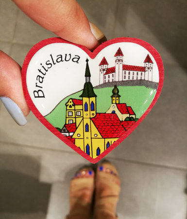 hand holding a souvenir from a European cityの写真素材