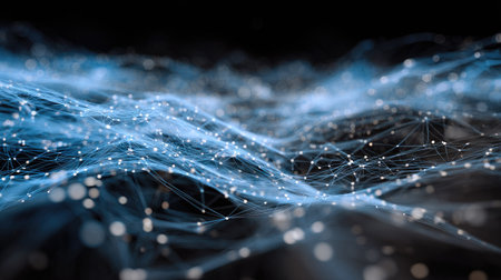 This image features a captivating abstract representation of digital waves with glowing particles, set against a deep blue and black background, ideal for technology themes.の素材