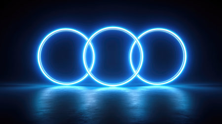 This image showcases three glowing neon circles on a dark background, ideal for enhancing modern design projects, digital media, and advertising.の素材