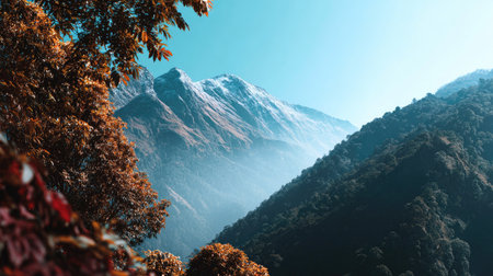Discover a stunning mountain landscape showcasing vibrant autumn colors under a clear blue sky. This serene scene captures the beauty of nature and invites exploration.の素材