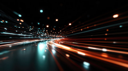 This abstract image captures dynamic light trails in vibrant colors, creating a sense of energy and movement against a dark backdrop.の素材