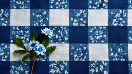 A captivating blue and white checkered fabric features charming small blue flowers and green leaves, creating a fresh and elegant arrangement perfect for spring decor.の素材