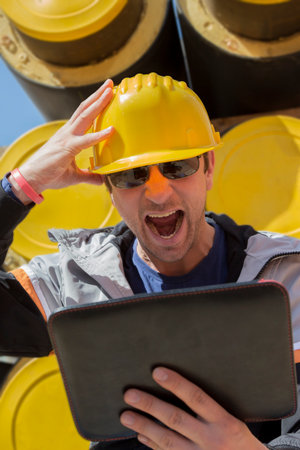 Builder realizes that he made a mistakeの写真素材