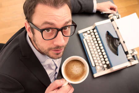 Writer getting ready for the creative work while enjoying the first morning coffee