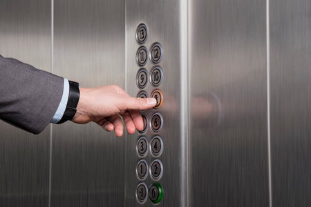 Finger pressing the button in the elevatorの写真素材