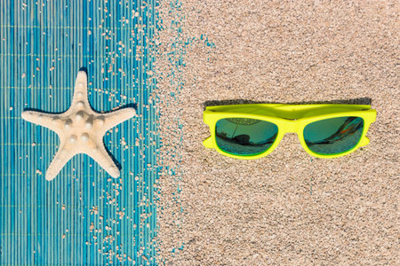Sunglasses and starfish flat lay. Summer vacation accessories concept.   の写真素材