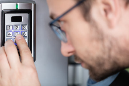 Close up of a man entering security code combination to unlock the door   