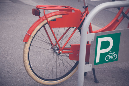 Close up of vintage bicycle parked on bike parking の写真素材