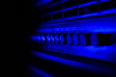 Close up of guitar amplifier control panel. Blue light, ideal for background, Space for copy. の写真素材