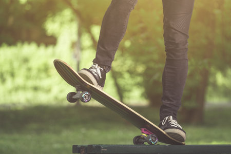 Close up of man legs ride on skate board の写真素材