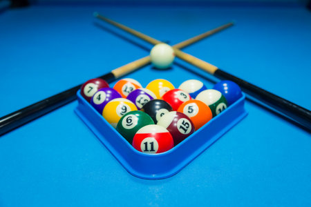 Billiards balls and cue on billiards tableの写真素材