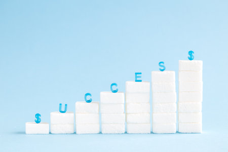 Financial chart made of sugar cubes against pastel blue background minimal success concept.の写真素材