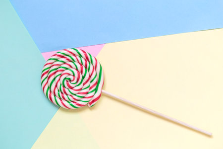 Lollipop on colorful pastel background minimal creative concept.の写真素材