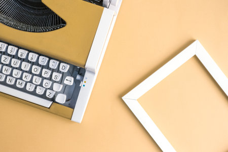 Retro vintage typewriter and photo frame yellow minimal creative concept.