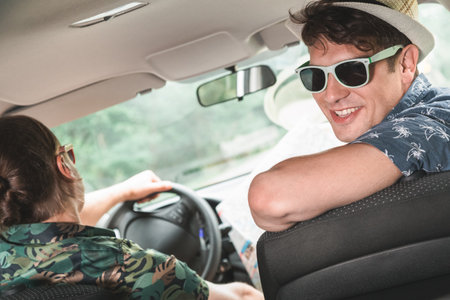 Hipster guys sitting in a car. Travel and adventure concept.の写真素材