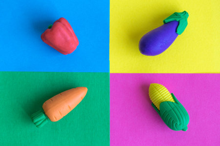 Rubber vegetables on colorful background minimal creative concept.の写真素材