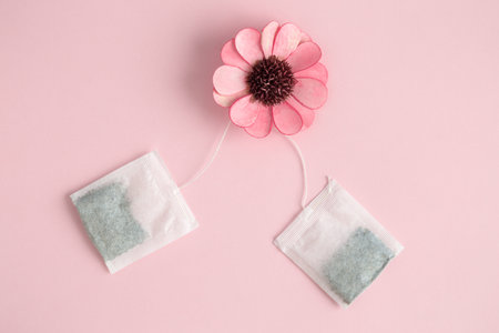 Flat lay of flower and tea bags minimal creative concept.の写真素材