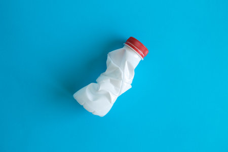Plastic bottle isolated over pastel blue background minimal creative eco concept.の写真素材