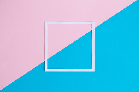 White frame on colorful pastel background minimal creative concept. Space for copy.の写真素材