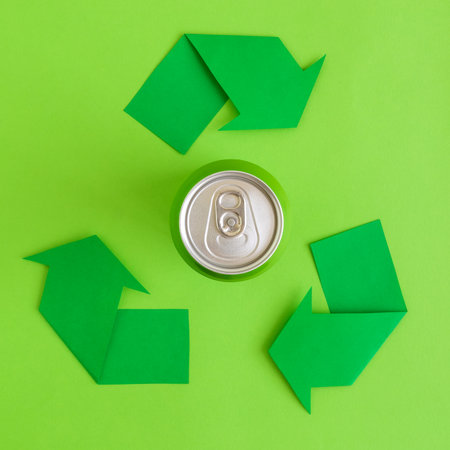 Flat lay of aluminum can and recycle symbol arrows minimal eco friendly creative concept.の写真素材