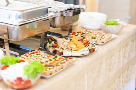 Catering served table with delicious food snacks.