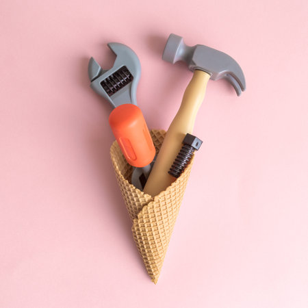 Set of carpentry tools in ice cream cone isolated on pastel pink background minimal creative...