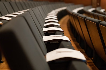 Exam paper sheet tests with pen on seats. University concept.の写真素材