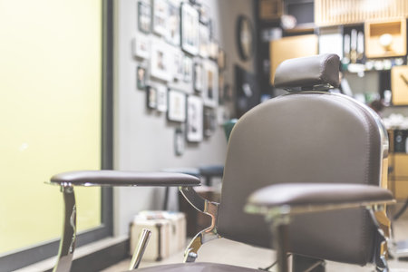 Stylish vintage barber shop chair. Modern hairdresser and hair salon interior.の写真素材