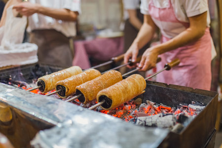 Preparation of the famous, traditional and delicious Hungarian Chimney Cakeの写真素材