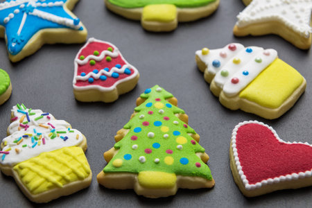 Colorful christmas cookies on table minimal creative holiday and sweet food concept.の写真素材