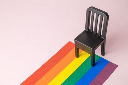 Creative composition made of rainbow flag and chair minimal creative diversity concept. Space for copy.の写真素材