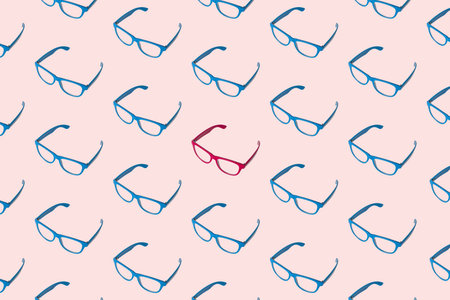 Pattern made of blue eyeglasses with one in pink color minimal creative diversity concept.の写真素材