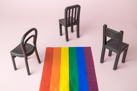 Creative diversity composition made of chairs and rainbow flag minimal creative concept. Space for copy.の写真素材