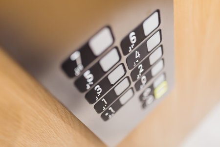 Close up of elevator control panel buttons.