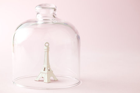 Paris in quarantine coronavirus covid-19 isolation abstract made of Eiffel Tower covered with glass cover.の写真素材