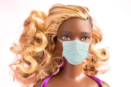 Afro-american doll with protective medical mask composition minimal creative concept.の写真素材