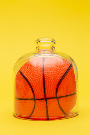 Basketball ball under glass cover isolation covid-19 abstract.の写真素材