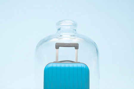 Suitcase in quarantine minimal creative coronavirus travel restriction concept.の写真素材