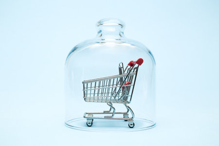 Shopping cart in quarantine minimal creative coronavirus and business concept.の写真素材