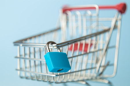 Close up of padlock on shopping cart minimal creative supermarket closed concept.の写真素材