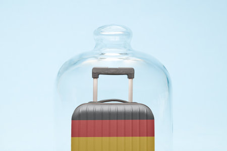 Suitcase with Germany flag design in quarantine minimal creative coronavirus travel restriction concept.の写真素材