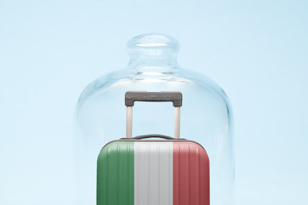 Suitcase with Italian flag design in quarantine minimal creative coronavirus travel restriction concept.の写真素材
