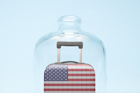 Suitcase with united states flag design in quarantine minimal creative coronavirus travel restriction concept.の写真素材